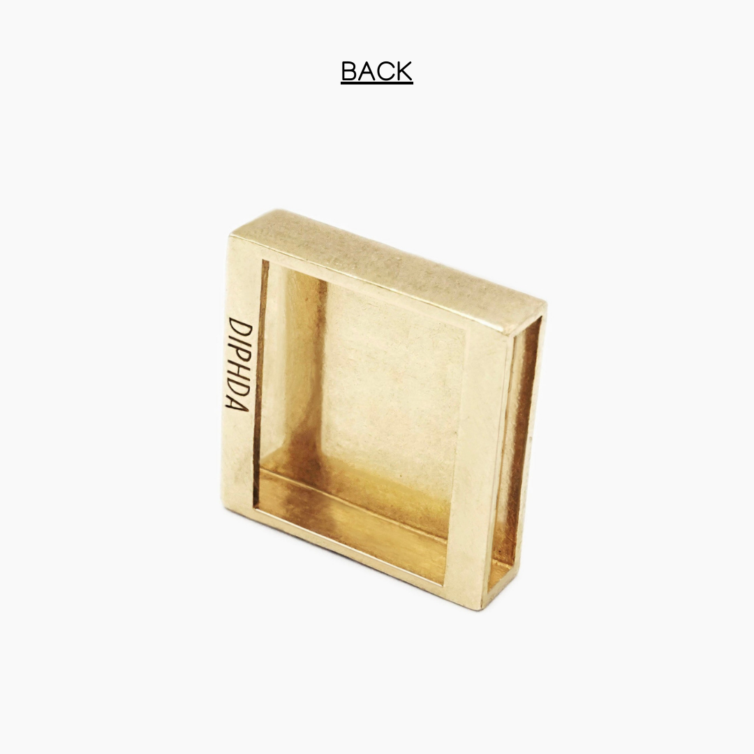 Back of gold finish moon slider charm