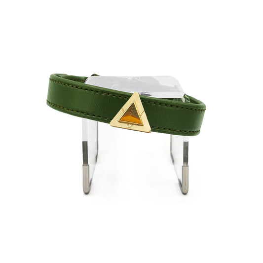 Olive green collar with tiger eye charm on white background